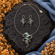 Natural Sage Ribbon Cascade necklace and matching earrings displayed on dark stone


