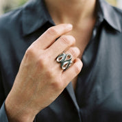 Woman wearing Natural Sage Ribbon Cascade adjustable statement ring

