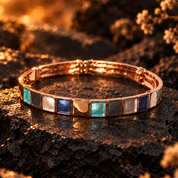 Rose gold boho Mosaic Squares bangle bracelet with teal blue gray and metallic accents on dark stone

