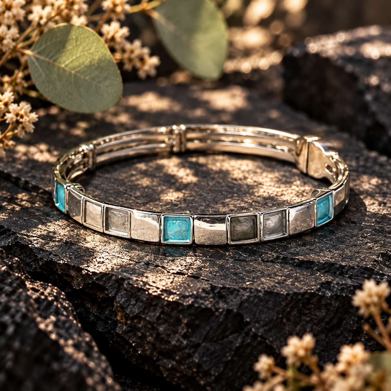 Silver geometric Squares bangle bracelet with turquoise accent on dark textured stone
