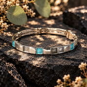 Silver geometric Squares bangle bracelet with turquoise accent on dark textured stone
