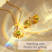 Gold sunburst birthstone jewelry set featuring a pendant necklace and matching stud earrings with brilliant green peridot gemstones. This celestial-inspired jewelry set makes a meaningful gift for birthdays, bridesmaids, best friends, or girlfriends. Personalized with August’s peridot birthstone, but available in all 12 months from January garnet to December blue topaz. A radiant and stylish gift set, perfect for self-gifting, astrology lovers, or holiday presents.
