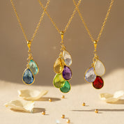 Personalized birthstone necklace for mom and grandma featuring multiple teardrop birthstones on a gold vermeil chain, custom family jewelry with January garnet, February amethyst, March aquamarine, April diamond quartz, May emerald, and June pearl stones, meaningful mother necklace with children’s birthstones, sentimental gift for mom, grandma necklace with grandkids, handmade minimalist family birthstone jewelry