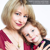 A mother wearing a leaf cascade necklace holds her young daughter. birthstone jewelry, personalized family tree, custom birthstone necklace, family tree pendant with names, custom engraved jewelry, sterling silver jewelry for mom, anniversary gifts for her, family birthstone jewelry, unique personalized gifts, family tree necklace for women, custom made jewelry, engraved custom necklaces, personalized family tree pendant, meaningful anniversary gift, family birthstone pendant, personalized necklace for mom