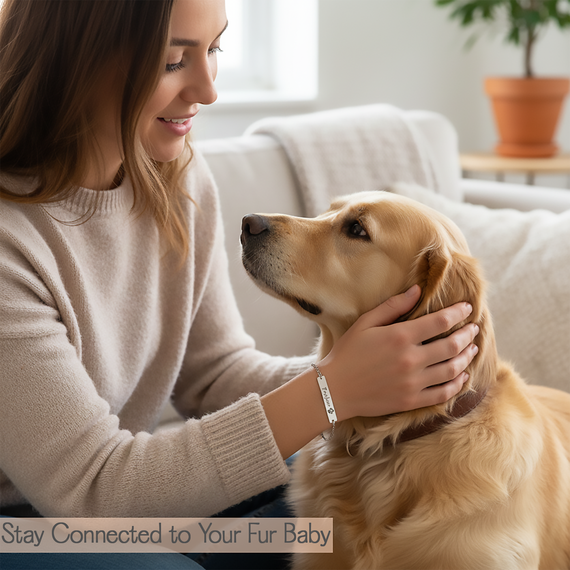 Woman wearing a silver engraved pet's name bracelet while petting a dog in a cozy living room with text 'Stay Connected to Your Fur Baby'.