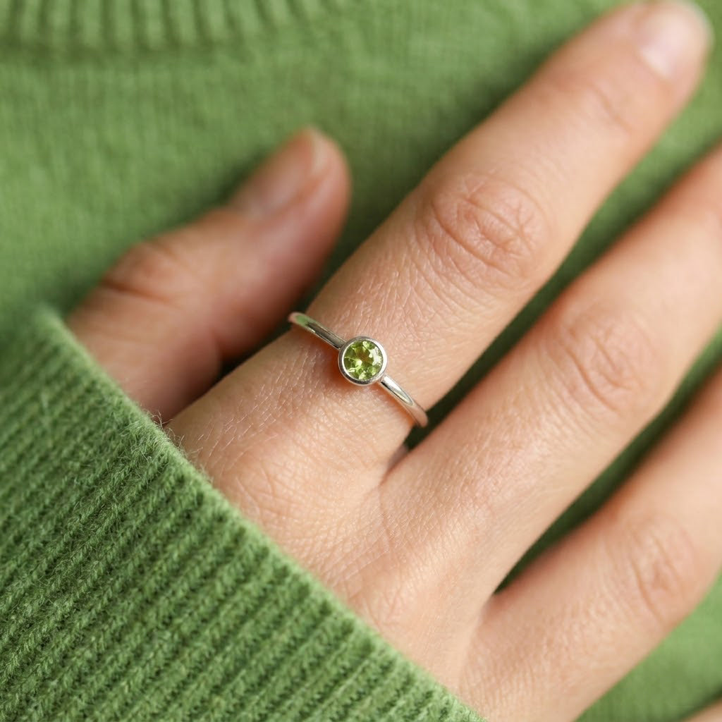 dainty peridot ring on hand minimal gold stacking ring everyday jewelry for women