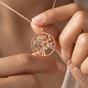 Hand holding personalized birthstone mom necklace, close-up of family tree pendant with colorful birthstones, custom tree of life necklace for mom, sentimental family jewelry gift, elegant birthstone pendant for women, meaningful necklace for mother, grandma, or wife, custom family birthstone necklace in rose gold sterling silver or yellow gold, Mother’s Day necklace gift, keepsake jewelry celebrating children and loved ones