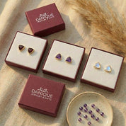 Labradorite triangle stud earrings displayed in Danique Jewelry gift boxes, ready for gifting.