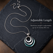 Adjustable long boho triple circle necklace showing chain length
