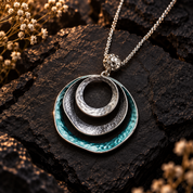 Boho triple circle statement necklace in silver and teal geometric design
