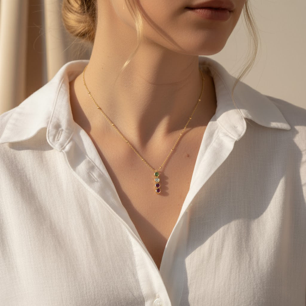 Dainty gold birthstone bar necklace worn by woman, personalized with children’s birthstones, sentimental layered jewelry gift for moms, daughters, or grandmothers.