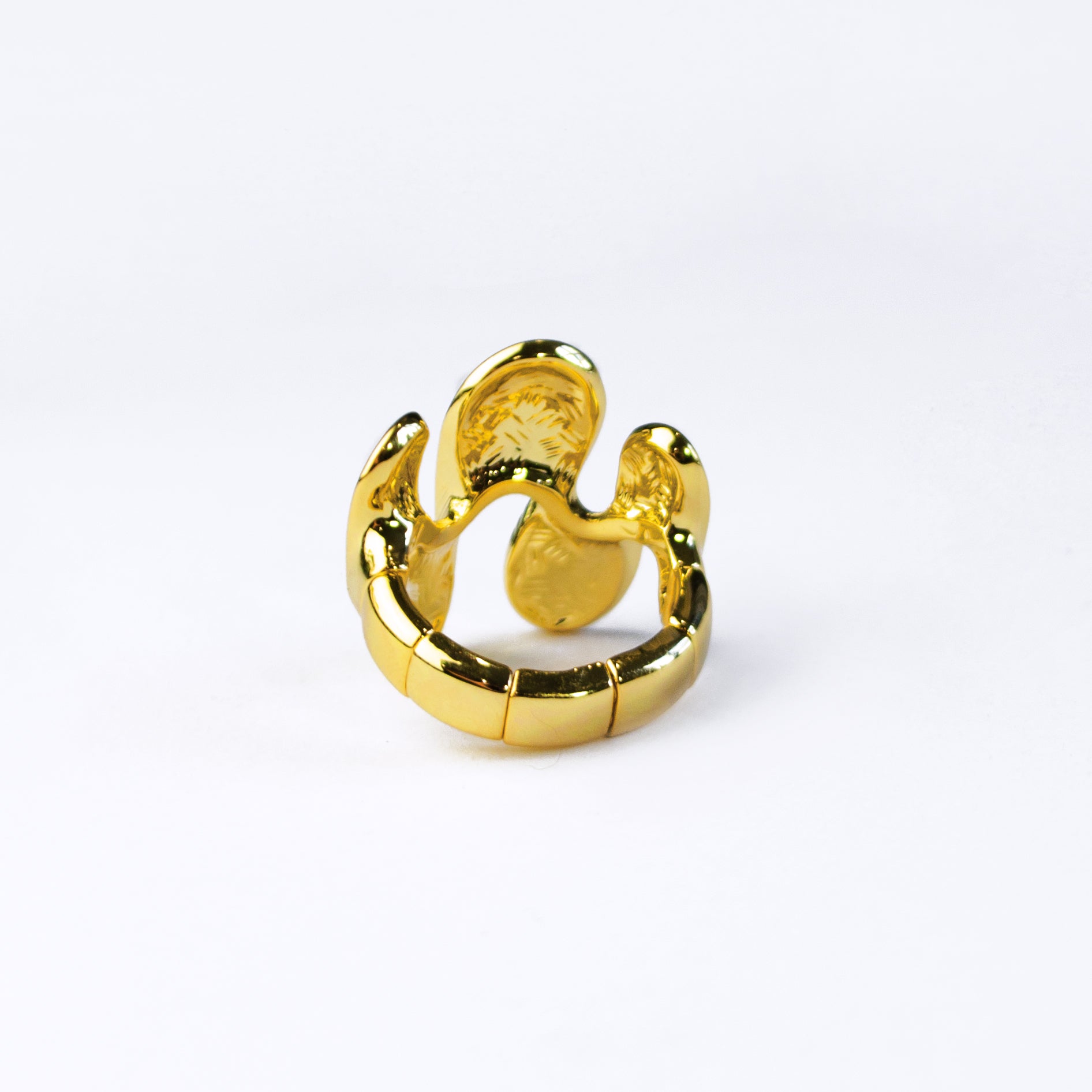 Back view of gold abstract waves ring against a white background. Ring is adjustable Size 7 and up.