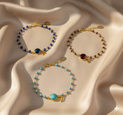 Set of personalized initial and birthstone bracelets in gold and silver, customizable with January garnet, May emerald, July ruby, or November citrine gemstones, perfect bridesmaid or best friend gift.