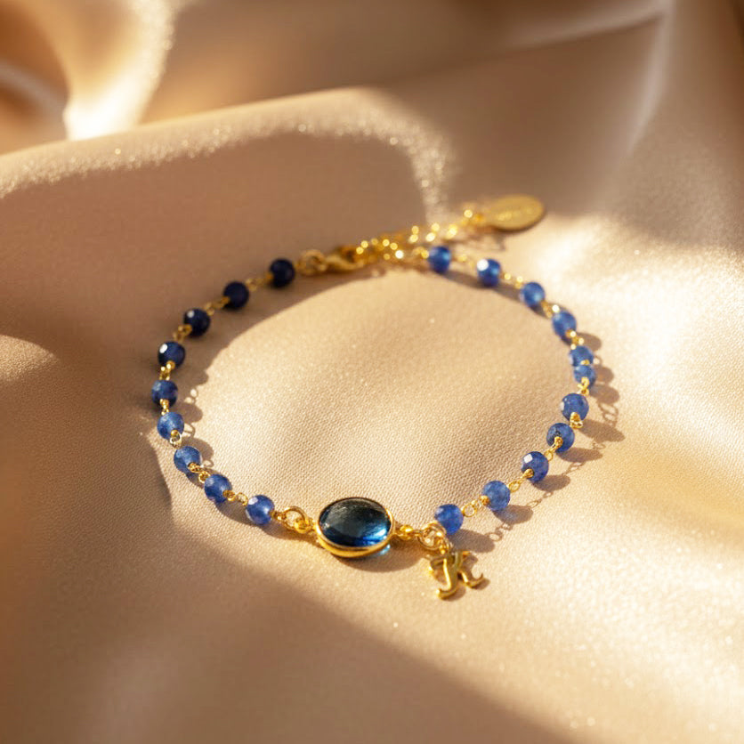 Dainty blue birthstone bracelet with initial charm, sapphire and aquamarine gemstone accents, adjustable gold chain, personalized bridesmaid jewelry gift for something blue or September birthstone keepsake.