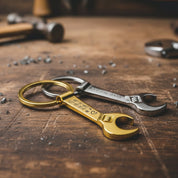 Single gold toned wrench keychain with special GPS coordinates engraved and a heart emoji. Single silver tone wrench keychain engraved with special message. bottle opener keychain