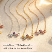 Custom birthstone necklace worn on model, featuring a delicate zigzag gemstone design for children’s birthstones or family stones shown in sterling silver or rose gold.