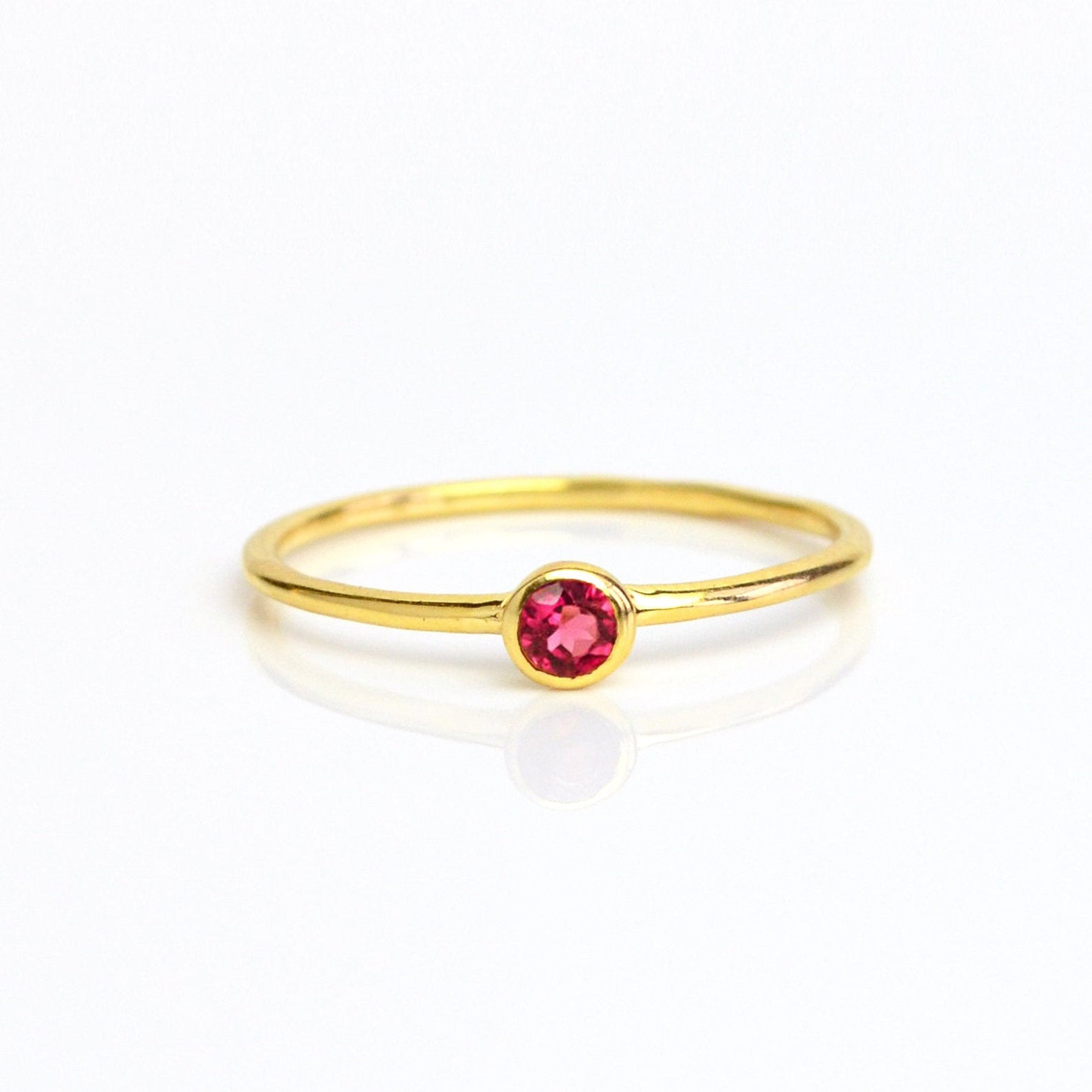 Single gold plated dainty 3mm Ruby gemstone ring. July  birthstone. On white background. 925 sterling silver, birthstone ring, stacking ring, stackable, birthstone jewelry, facet gemstone