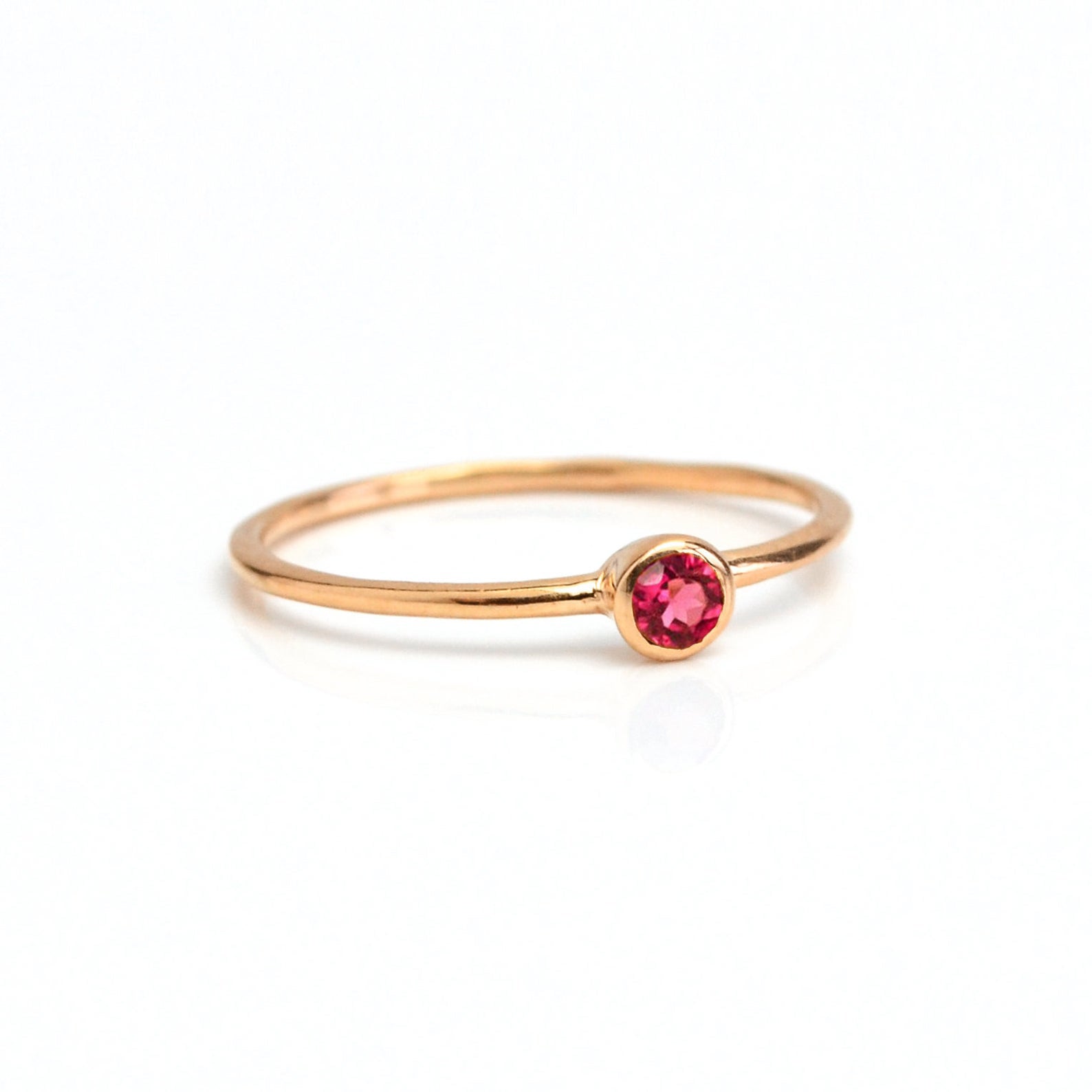 Single rose gold plated dainty 3mm Ruby gemstone ring. July  birthstone. On white background. 925 sterling silver, birthstone ring, stacking ring, stackable, birthstone jewelry, facet gemstone