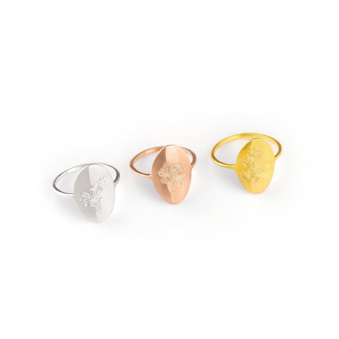 Three floral flower engraved rings to correspond to your birth month! Available in sterling silver, gold and rose gold.