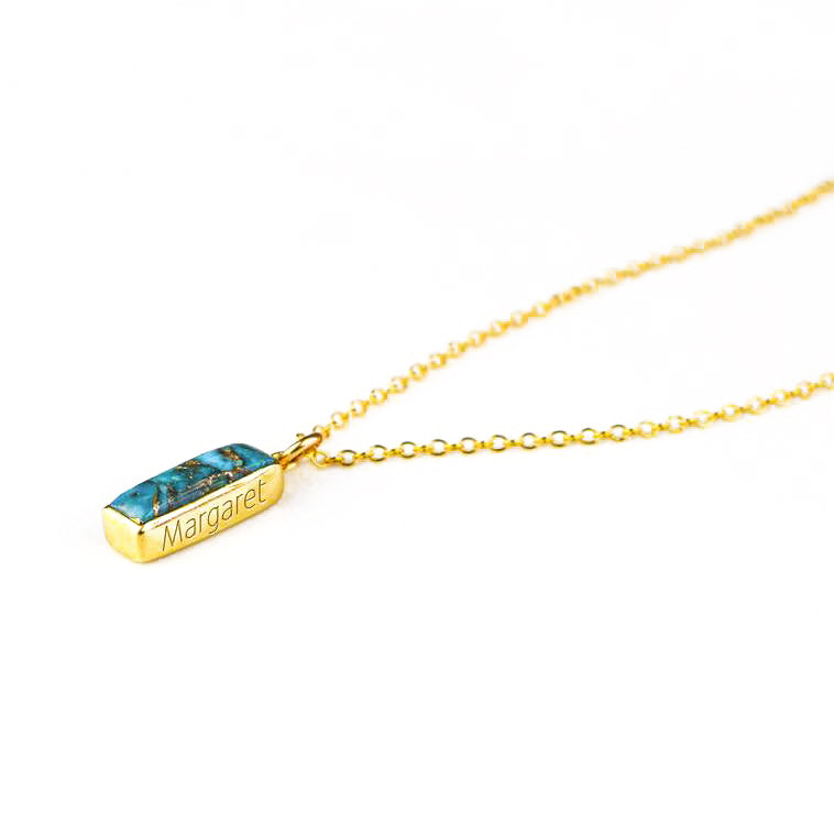 Vertical copper turquoise Adira bar necklace with gold filled cable chain and secret message engraving in our font with white background. December Birthstone 