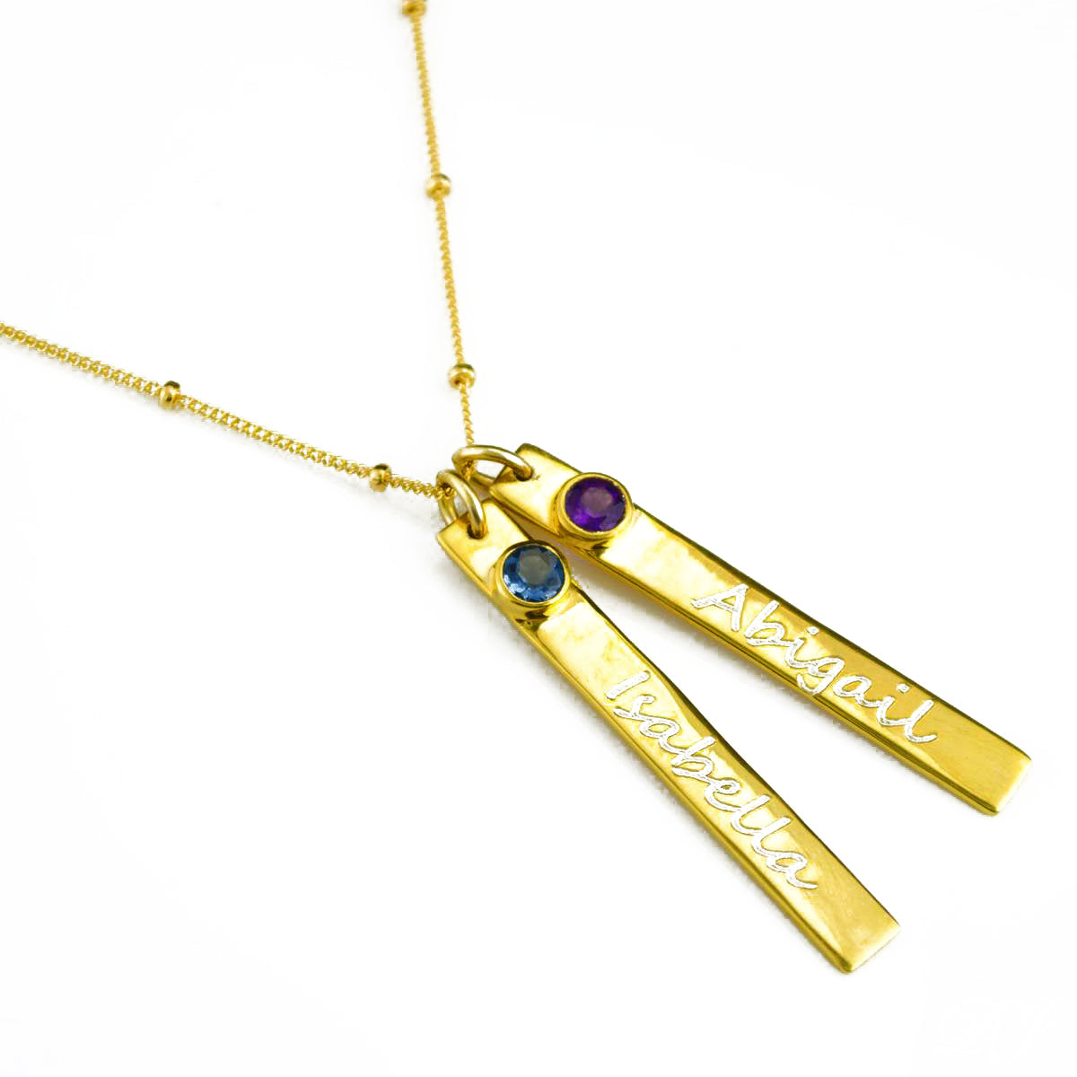 Gold filled satellite necklace with two bars and gemstones with engraved names in script font. One kyanite birthstone and one purple amethyst birthstone