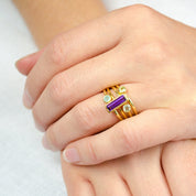 Colorful Mom and kids birthstone stacking rings worn together
