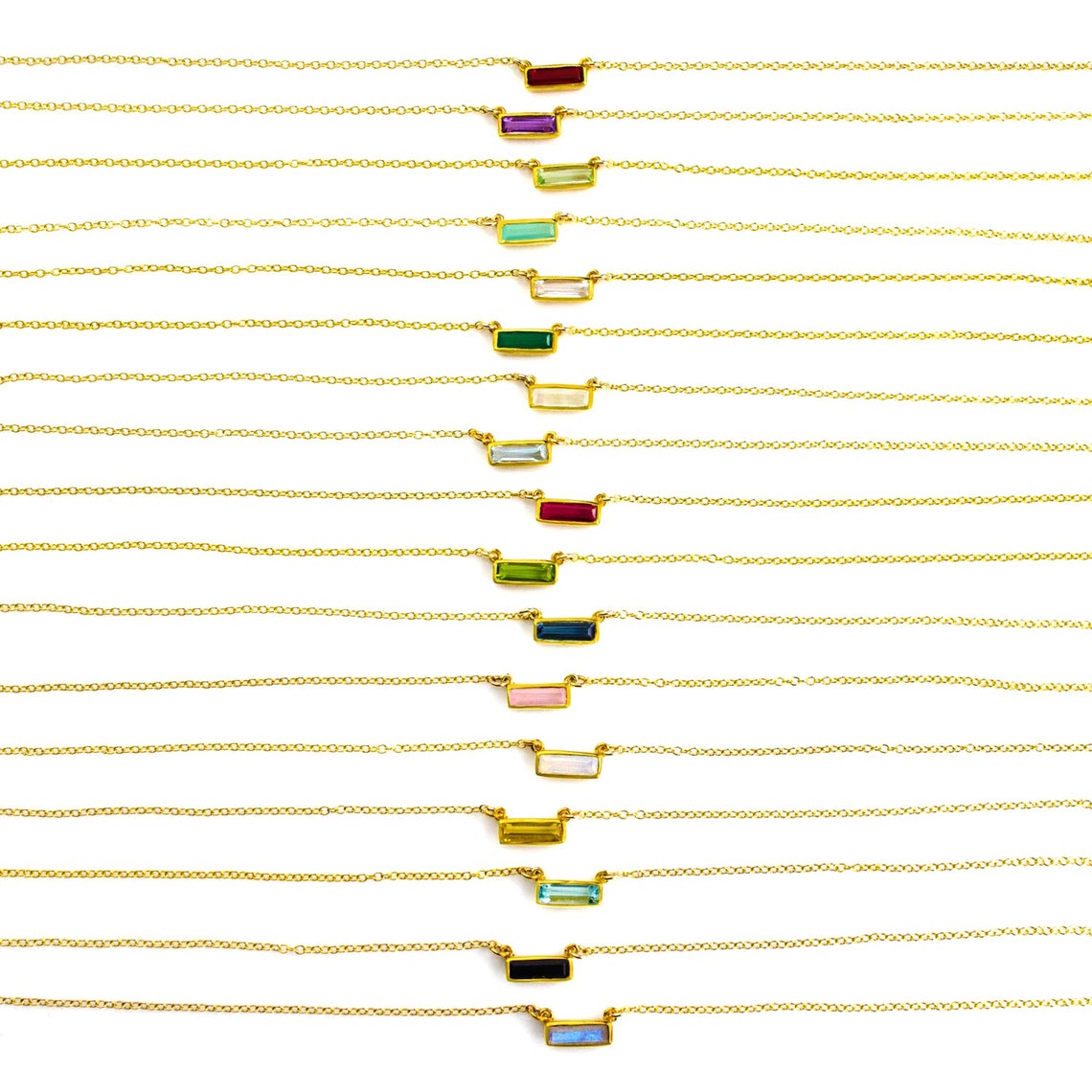 Adira gemstone bar connectors come in a variety of stone options including garnet, purple amethyst, green amethyst, aqua, clear, green onyx, alexandrite, moonstone, ruby, peridot, kyanite, pink chalcedony, opalite, citrine sky blue, copper turquoise, labradorite, green tourmaline, and black onyx. 