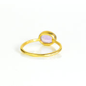 a rear view of a gold purple amethyst ring shown on white background. stackable! Stacking rings, bezel set, small oval, tiny oval, dainty oval, birthstone rings, sterling silver stamp, birthstone ring, birthstone jewelry, green gemstone, green birthstone, october birthstone, october gemstone