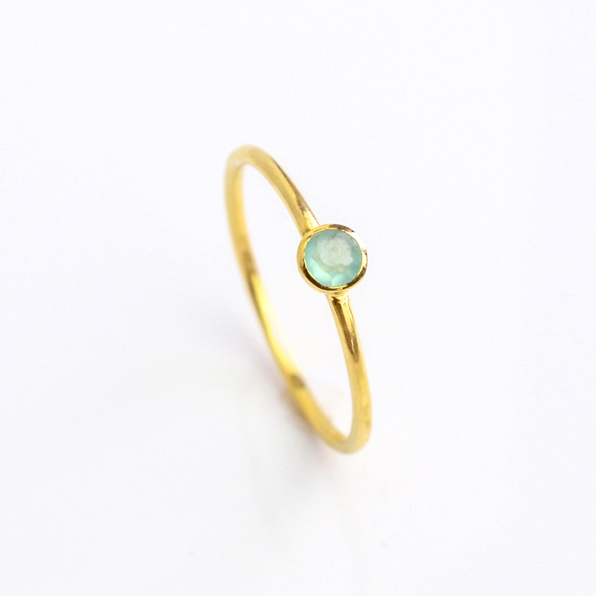 Single gold plated dainty 3mm aqua chalcedony gemstone ring. march  birthstone. On white background. 925 sterling silver, birthstone ring, stacking ring, stackable, birthstone jewelry, facet gemstone
