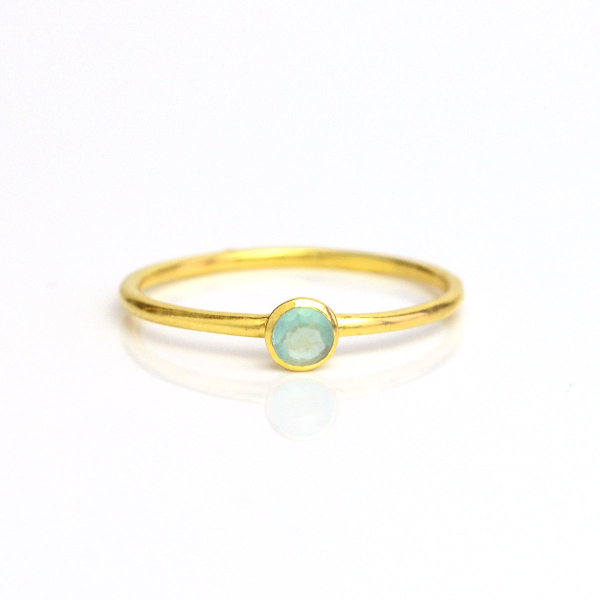 Single gold plated dainty 3mm aqua chalcedony gemstone ring. march  birthstone. On white background. 925 sterling silver, birthstone ring, stacking ring, stackable, birthstone jewelry, facet gemstone
