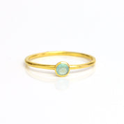 Single gold plated dainty 3mm aqua chalcedony gemstone ring. march  birthstone. On white background. 925 sterling silver, birthstone ring, stacking ring, stackable, birthstone jewelry, facet gemstone