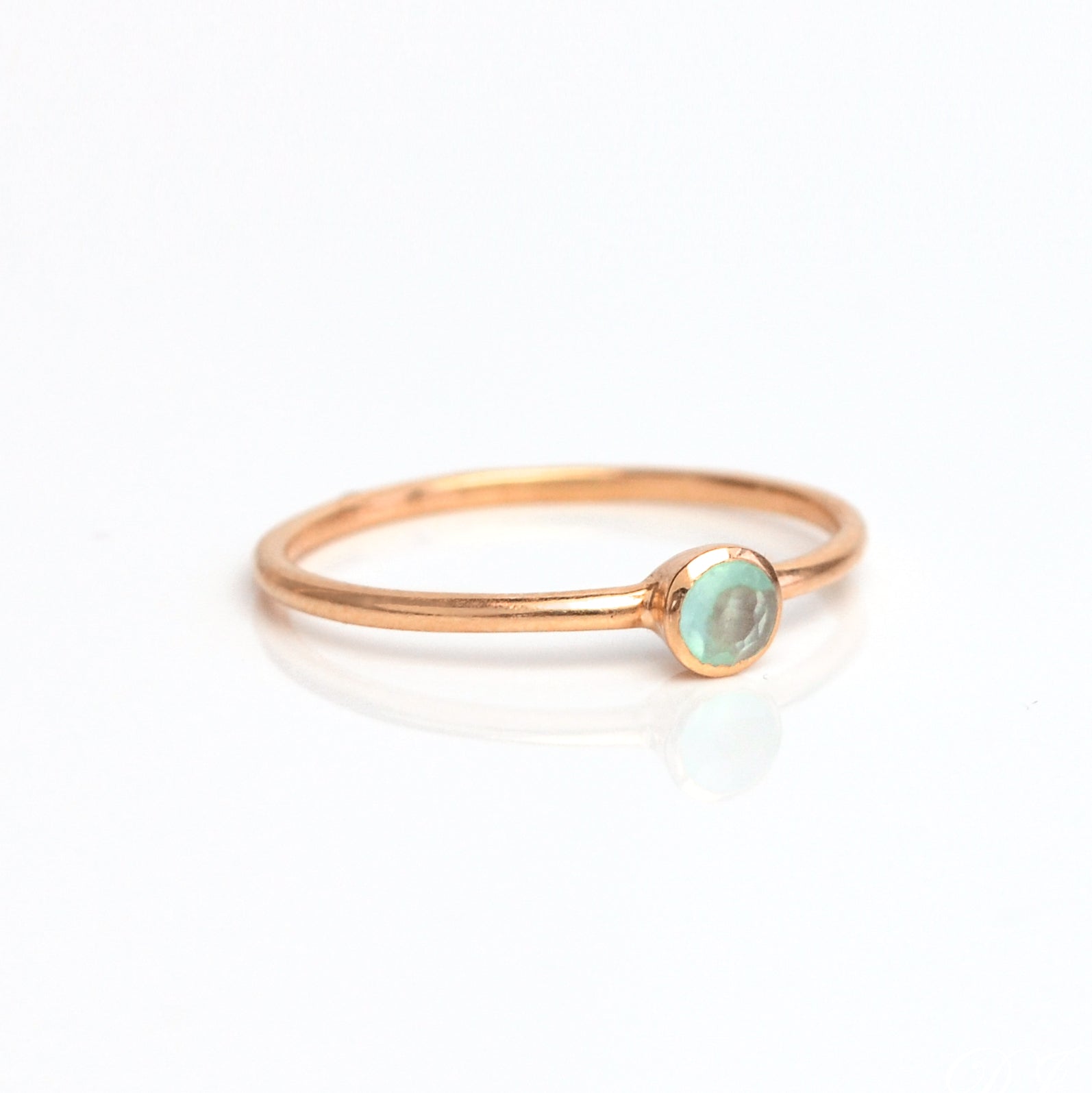 Single rose gold plated dainty 3mm aqua chalcedony gemstone ring. march  birthstone. On white background. 925 sterling silver, birthstone ring, stacking ring, stackable, birthstone jewelry, facet gemstone