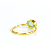 rear view of a gold aqua chalcedony ring shown on white background. Stacking rings, bezel set, small oval, tiny oval, dainty oval, birthstone rings, sterling silver stamp, birthstone ring, birthstone jewelry, march birthstone, march gemstone, stack set, stacking rings, gemstone ring, birthstone ring, mother's day gift for her, gift for mom, gift for fiance, gift for girlfriend, wedding jewelry, bridesmaid jewelry, anniversary jewelry, anniversary gift, birthday gift, christmas gift, valentine's day gift