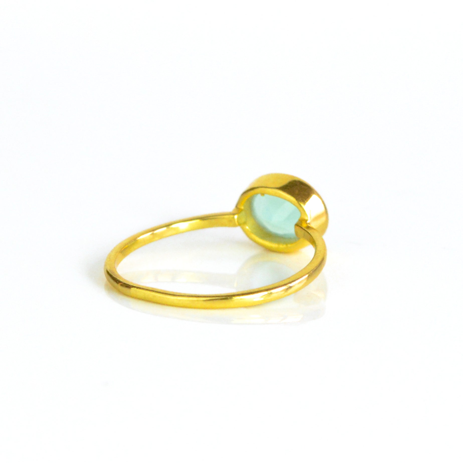 rear view of a gold aqua chalcedony ring shown on white background. Stacking rings, bezel set, small oval, tiny oval, dainty oval, birthstone rings, sterling silver stamp, birthstone ring, birthstone jewelry, march birthstone, march gemstone, stack set, stacking rings, gemstone ring, birthstone ring, mother's day gift for her, gift for mom, gift for fiance, gift for girlfriend, wedding jewelry, bridesmaid jewelry, anniversary jewelry, anniversary gift, birthday gift, christmas gift, valentine's day gift