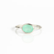 a sterling silver aqua chalcedony ring shown on white background. Stacking rings, bezel set, small oval, tiny oval, dainty oval, birthstone rings, sterling silver stamp, birthstone ring, birthstone jewelry, march birthstone, march gemstone, stack set, stacking rings, gemstone ring, birthstone ring, mother's day gift for her, gift for mom, gift for fiance, gift for girlfriend, wedding jewelry, bridesmaid jewelry, anniversary jewelry, anniversary gift, birthday gift, christmas gift, valentine's day gift