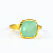 Aqua chalcedony gold plated cushion bezel square stacking ring on white background. march birthday, march gemstone square gemstone