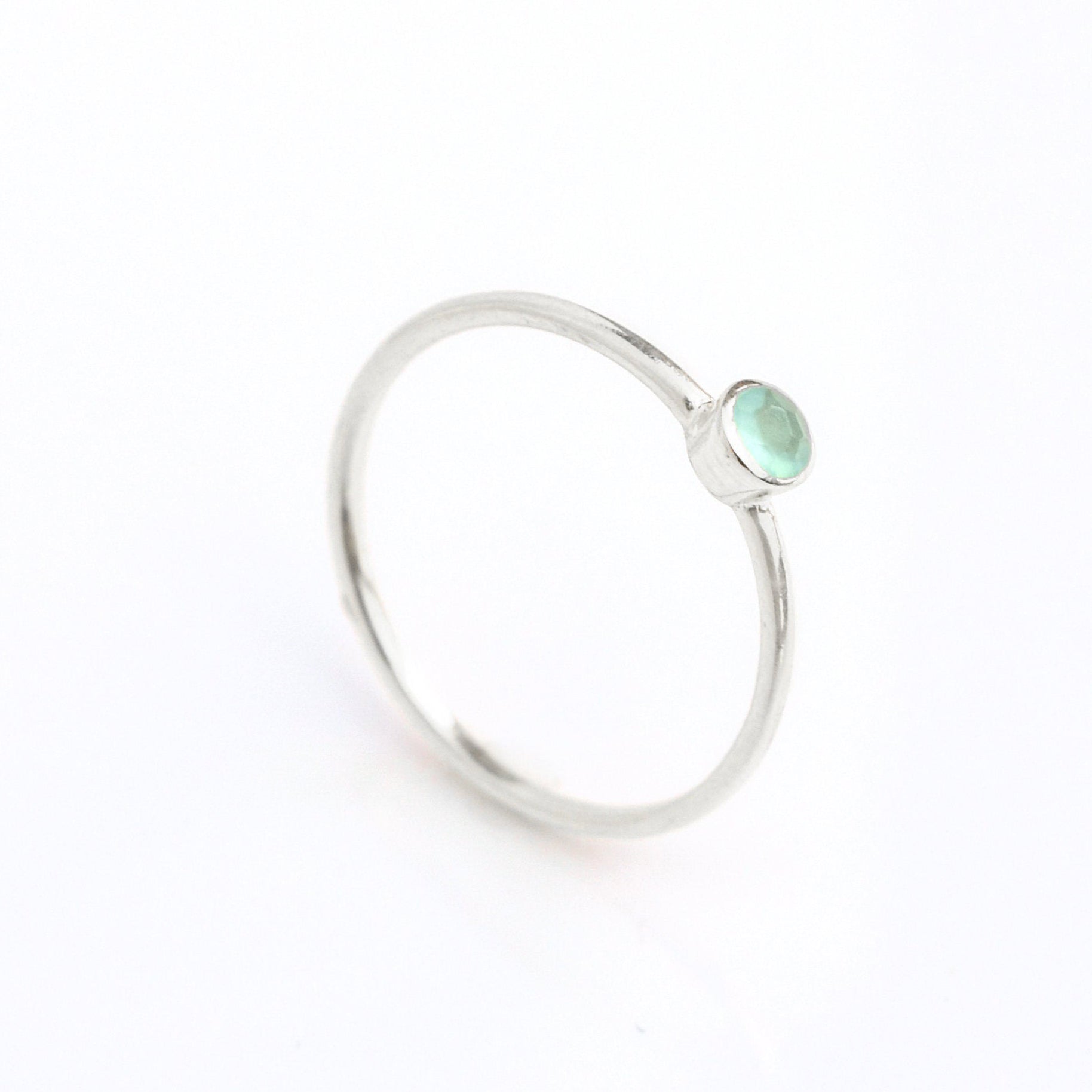 sterling silver dainty 3mm aqua chalcedony gemstone ring. march  birthstone. On white background. 925 sterling silver, birthstone ring, stacking ring, stackable, birthstone jewelry, facet gemstone
