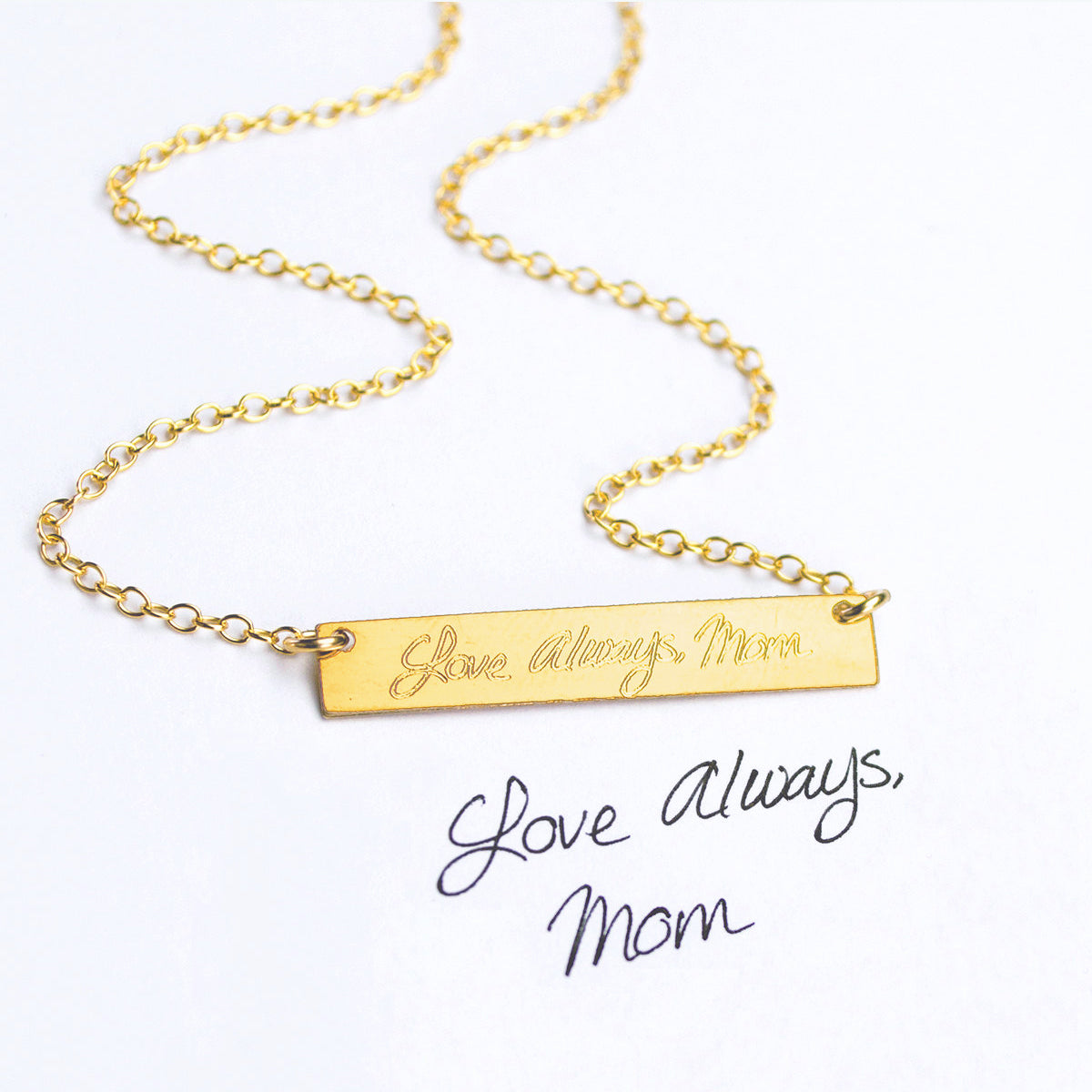 A gold bar necklace with handwritten Love Always, Mom engraved on the front from someones personal actual handwriting. custom handwriting engraved necklace, personalized sentimental memorial gift handwritten message handwritten note, custom grief gift for someone who lost a family member