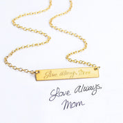 A gold bar necklace with handwritten Love Always, Mom engraved on the front from someones personal actual handwriting. custom handwriting engraved necklace, personalized sentimental memorial gift handwritten message handwritten note, custom grief gift for someone who lost a family member