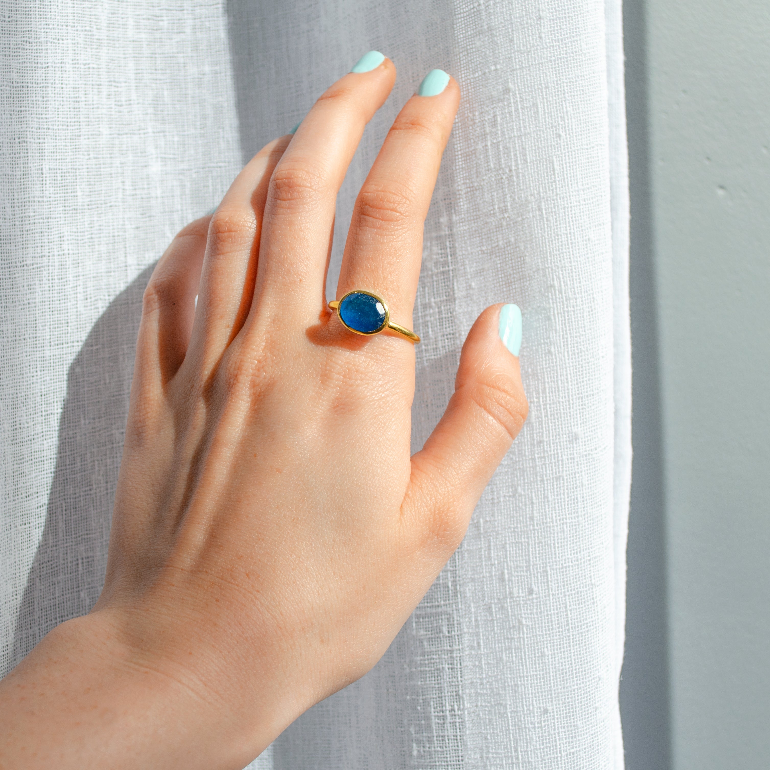 blue-black-jade-oval-ring-on-person.jpg