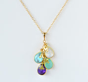 Gold filled cascade teardrop birthstone necklace with moonstone, blue topaz, aqua chalcedony and purple amethyst birthstones and plain letter initial charms. birthstone jewelry. 