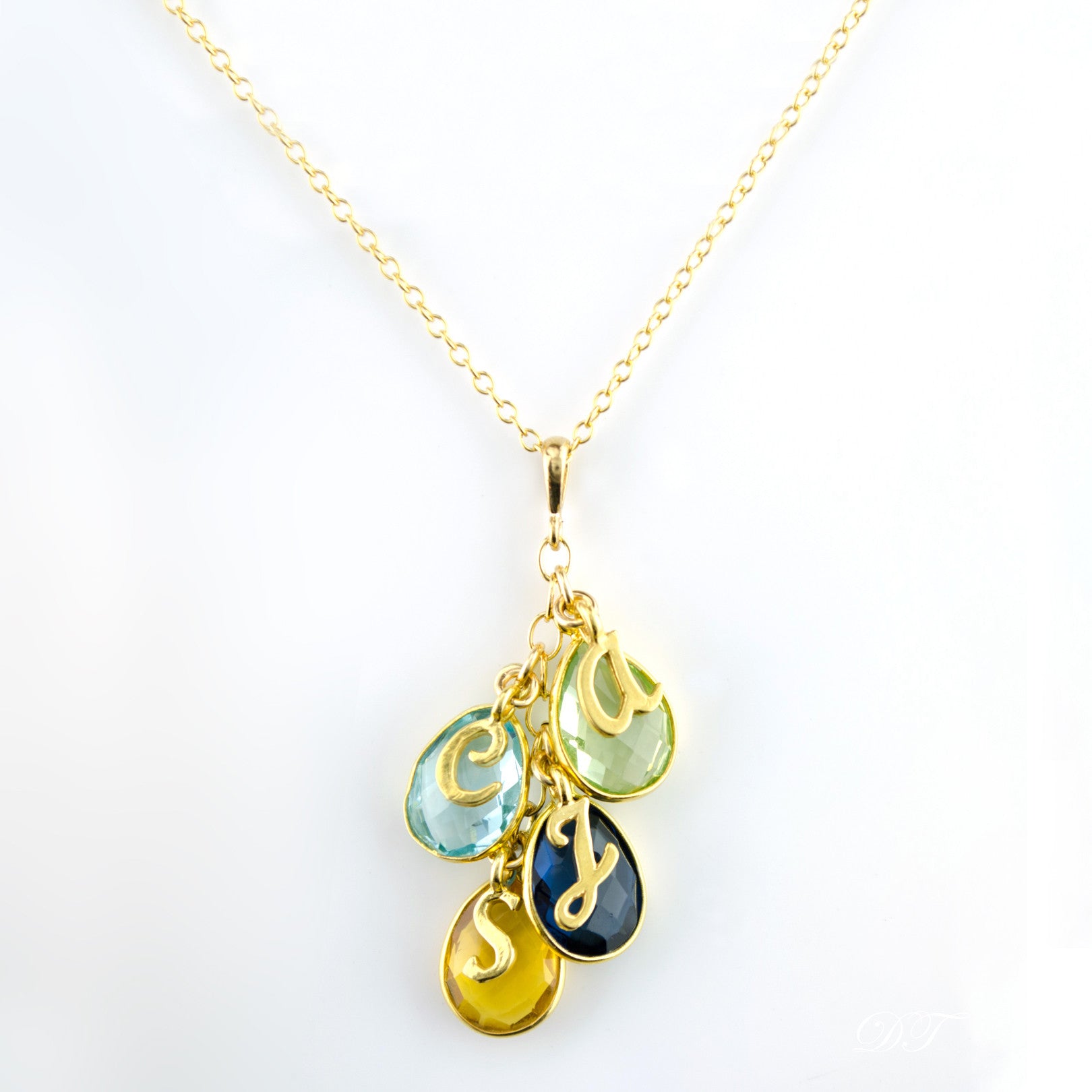 Gold filled cascade teardrop birthstone necklace with green amethyst, blue topaz, kyanite and citrine birthstones and script letter initial charms. birthstone jewelry. 