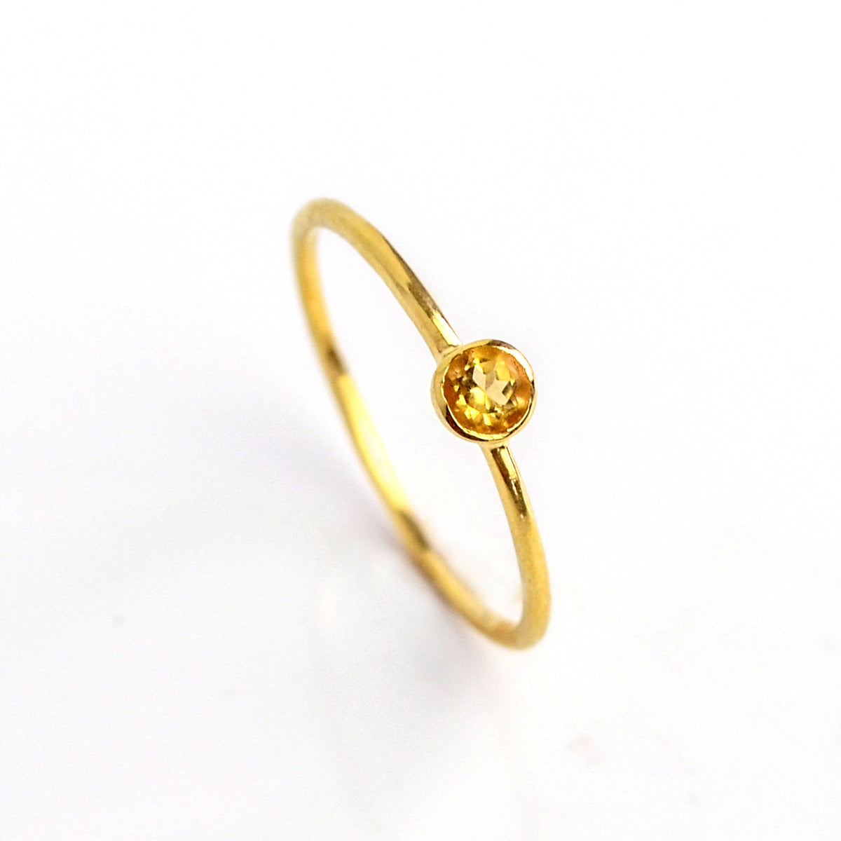 Single gold plated dainty 3mm citrine gemstone ring. November birthstone. On white background. 925 sterling silver, birthstone ring, yellow birthstone, stacking ring, stackable, birthstone jewelry, facet gemstone