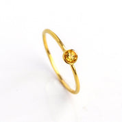Single gold plated dainty 3mm citrine gemstone ring. November birthstone. On white background. 925 sterling silver, birthstone ring, yellow birthstone, stacking ring, stackable, birthstone jewelry, facet gemstone