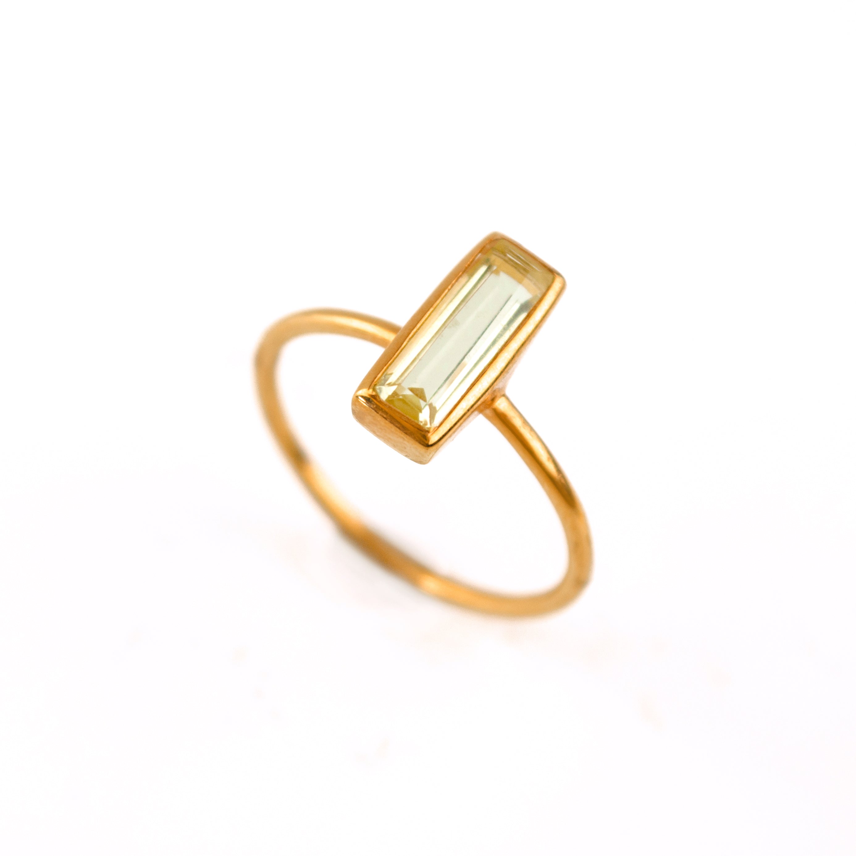 Single rose gold filled adira tiny bar citrine gemstone ring. November birthstone on white back ground. 