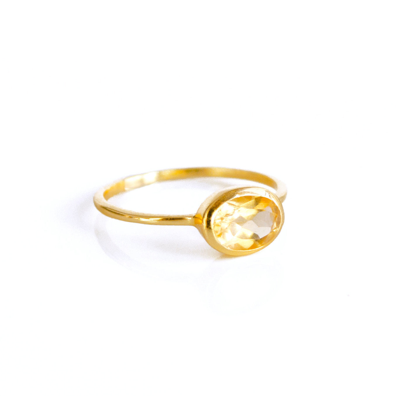 Single small gold plated oval citrine birthstone ring november birthstone ring on white background. stack set, stacking rings, gemstone ring, birthstone ring, mother's day gift for her, gift for mom, gift for fiance, gift for girlfriend, wedding jewelry, bridesmaid jewelry, anniversary jewelry, anniversary gift, birthday gift, christmas gift, valentine's day gift, valentine's day rings, dainty ring, cocktail ring, statement ring, bezel set