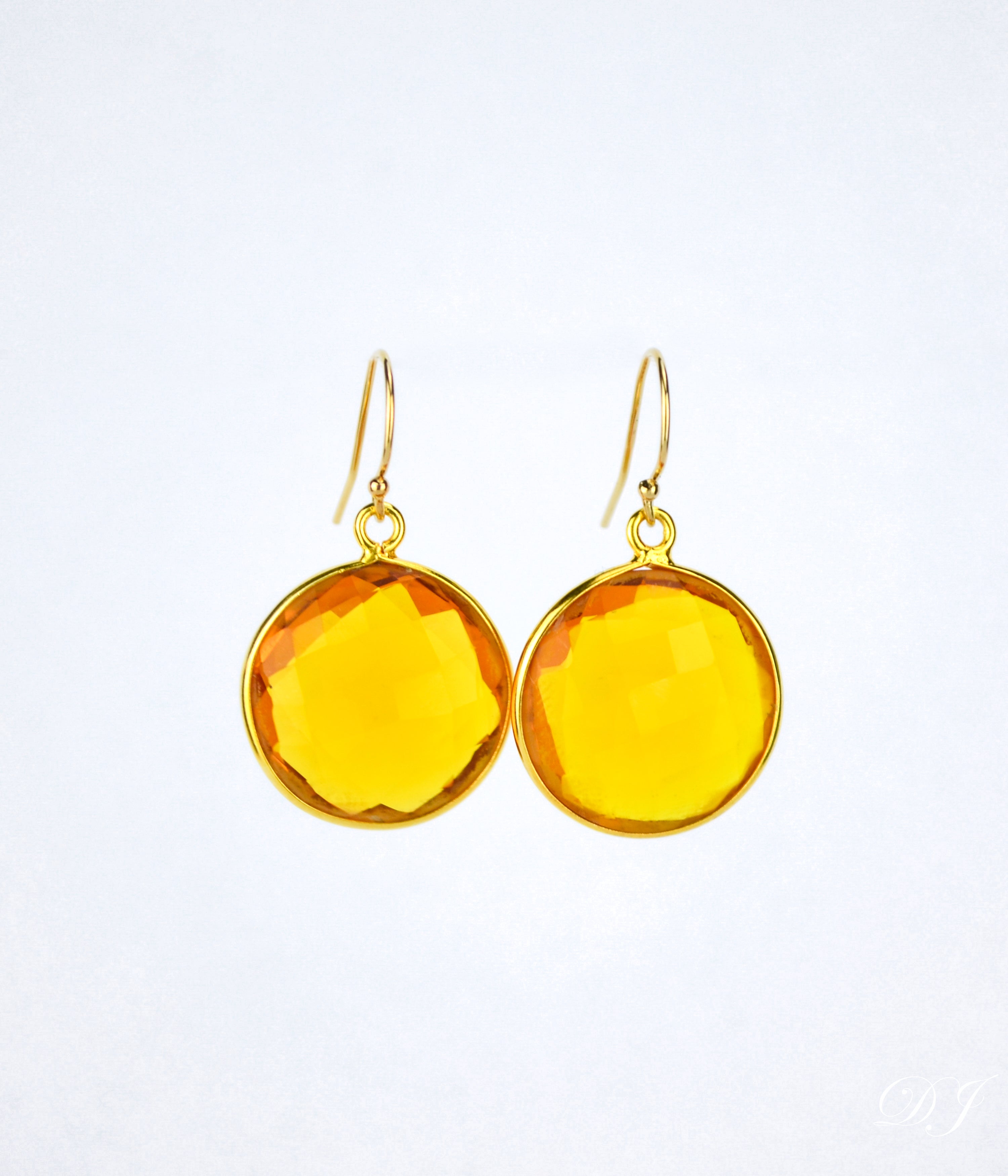 Large gold filled hook round citrine gemstone earrings. November birthstone on white background