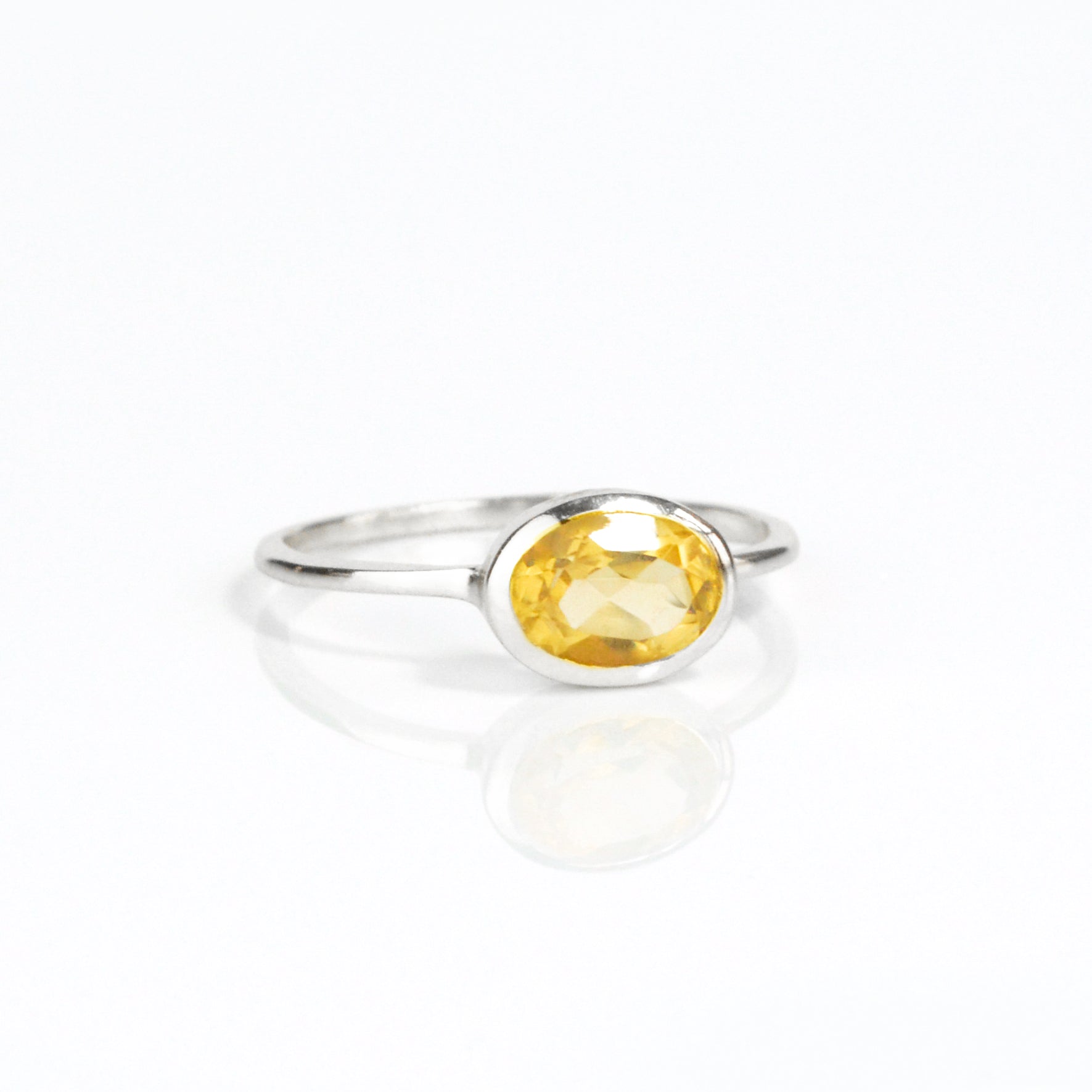 sterling silver small oval citrine birthstone ring november birthstone ring on white background. stack set, stacking rings, gemstone ring, birthstone ring, mother's day gift for her, gift for mom, gift for fiance, gift for girlfriend, wedding jewelry, bridesmaid jewelry, anniversary jewelry, anniversary gift, birthday gift, christmas gift, valentine's day gift, valentine's day rings, dainty ring, cocktail ring, statement ring, bezel set