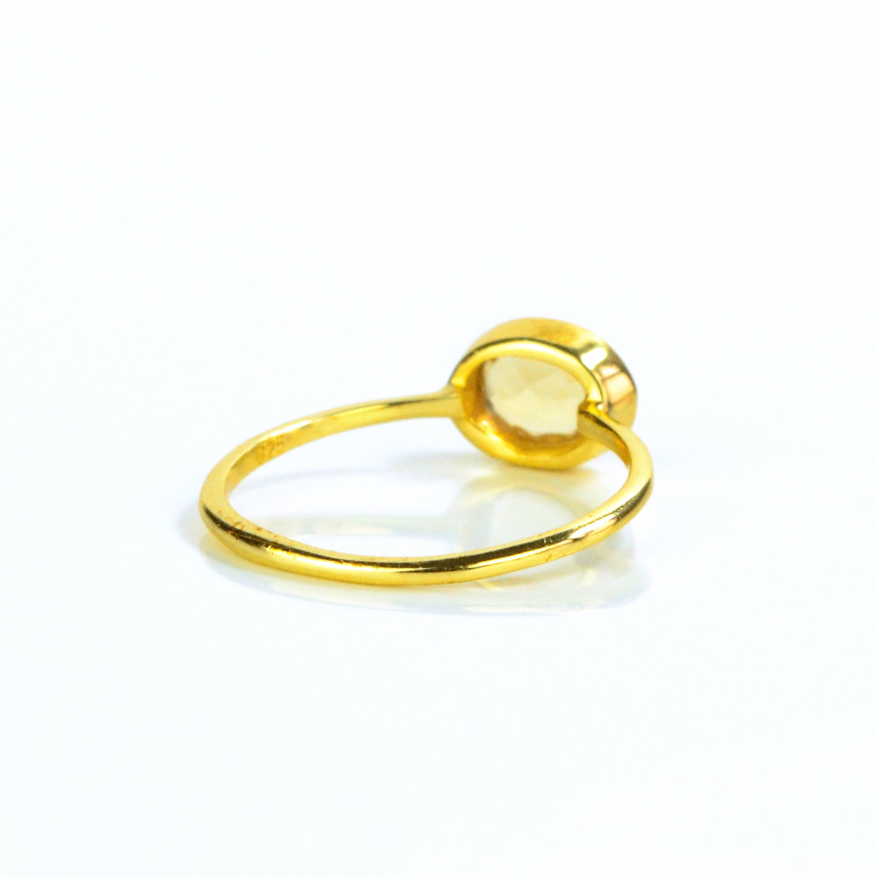 Small oval citrine birthstone november gemstone ring facing away, back view. Bezel set tiny ring. stack set, stacking rings, gemstone ring, birthstone ring, mother's day gift for her, gift for mom, gift for fiance, gift for girlfriend, wedding jewelry, bridesmaid jewelry, anniversary jewelry, anniversary gift, birthday gift, christmas gift, valentine's day gift, valentine's day rings, dainty ring, cocktail ring, statement ring, bezel set