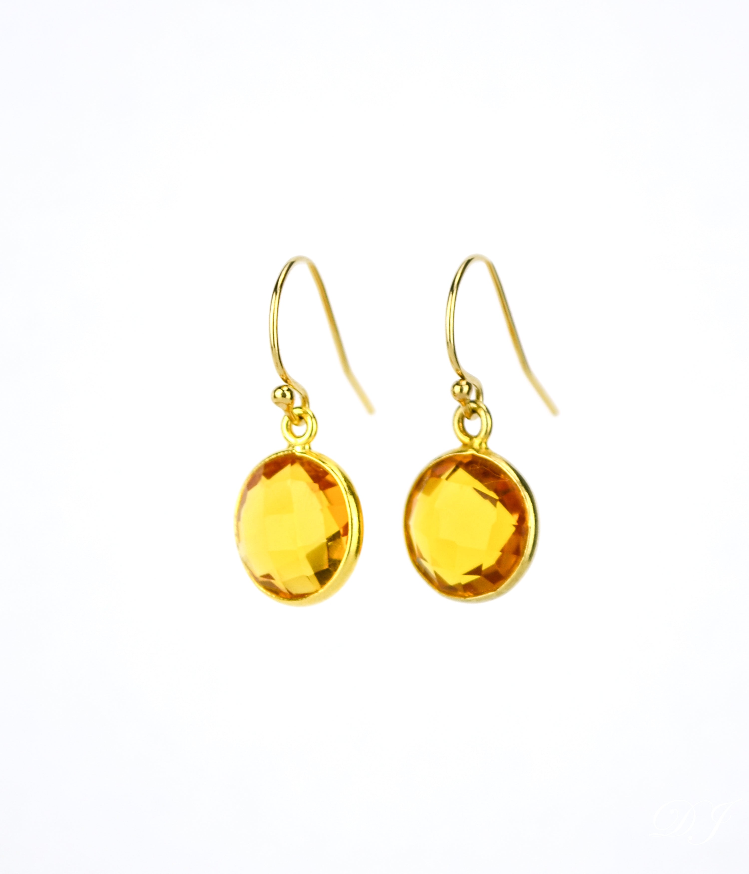 Small gold filled hook round citrine gemstone earrings. November birthstone on white background